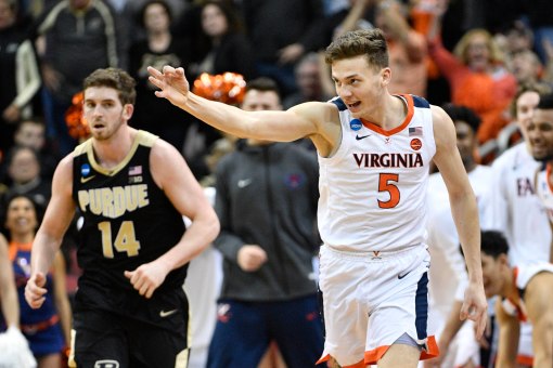 Mar 30, 2019; Louisville, KY, United States; Virginia Cavaliers guard Kyle Guy (5) reacts after making a three-pointer during the second half in the championship game against the Purdue Boilermakers of the south regional of the 2019 NCAA Tournament at KFC Yum Center. Mandatory Credit: Jamie Rhodes-USA TODAY Sports